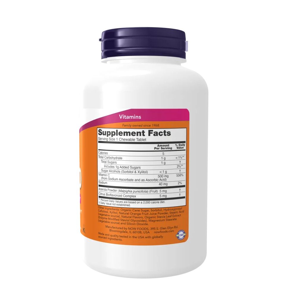 Retro del flacone di vitamina C-500. Contiene informazioni nutrizionali e ingredienti. Contenitore bianco con coperchio viola.
