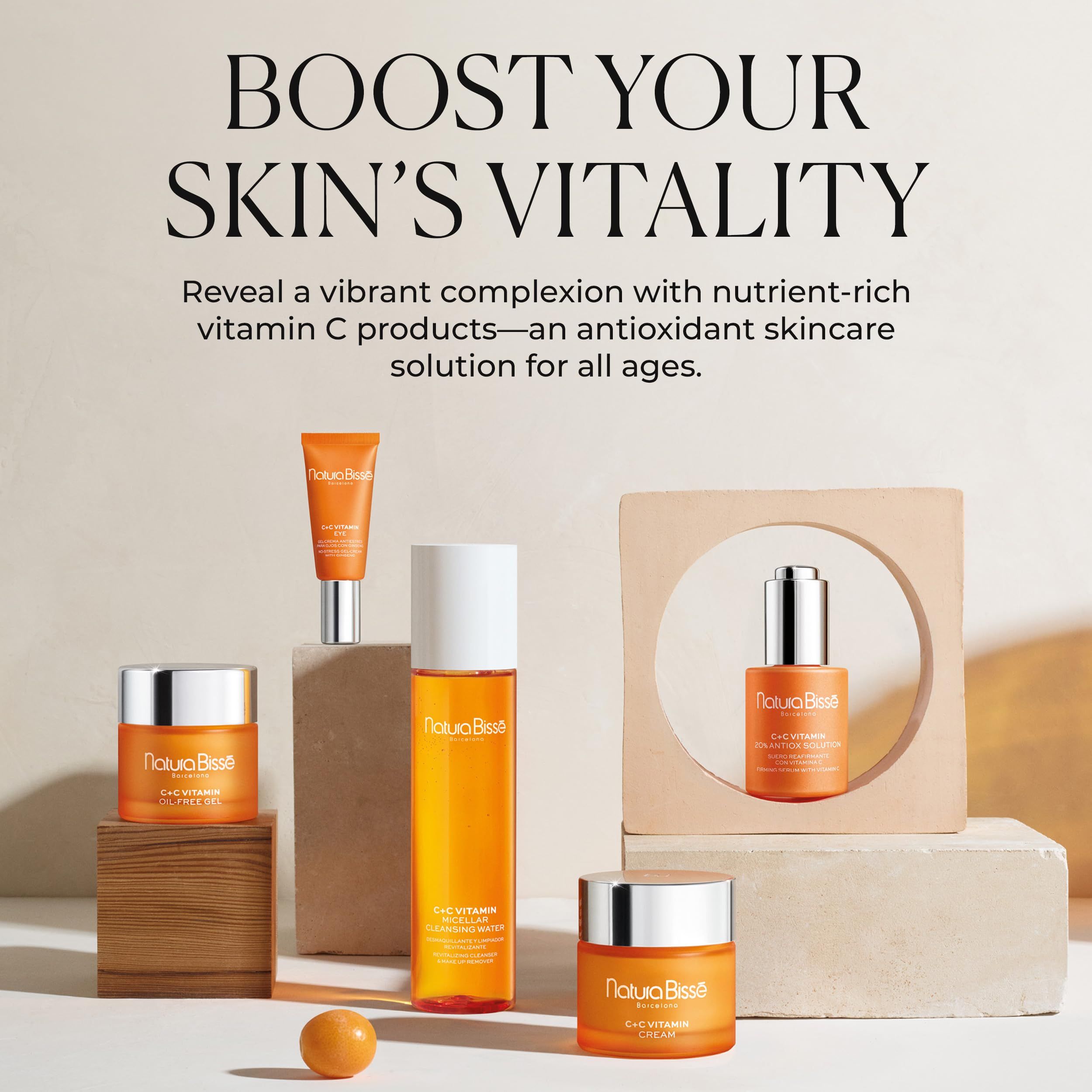 Vari prodotti su piedistalli. Testo: Boost Your Skin's Vitality. Prodotti Natura Bissé.
