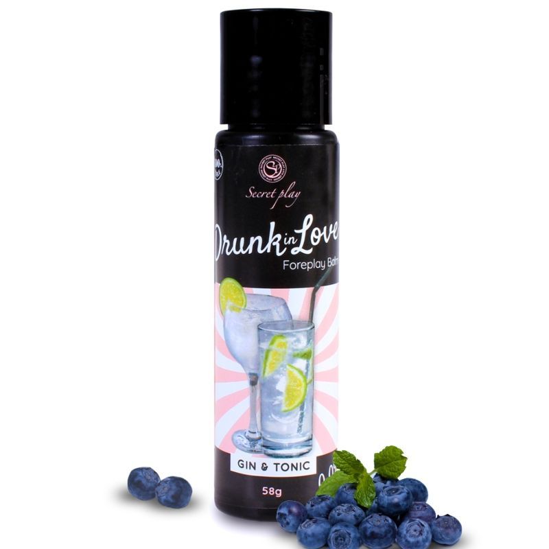 Flacone 'Drunk In Love' Balm Gin & Tonic, 58g, circondato da mirtilli.