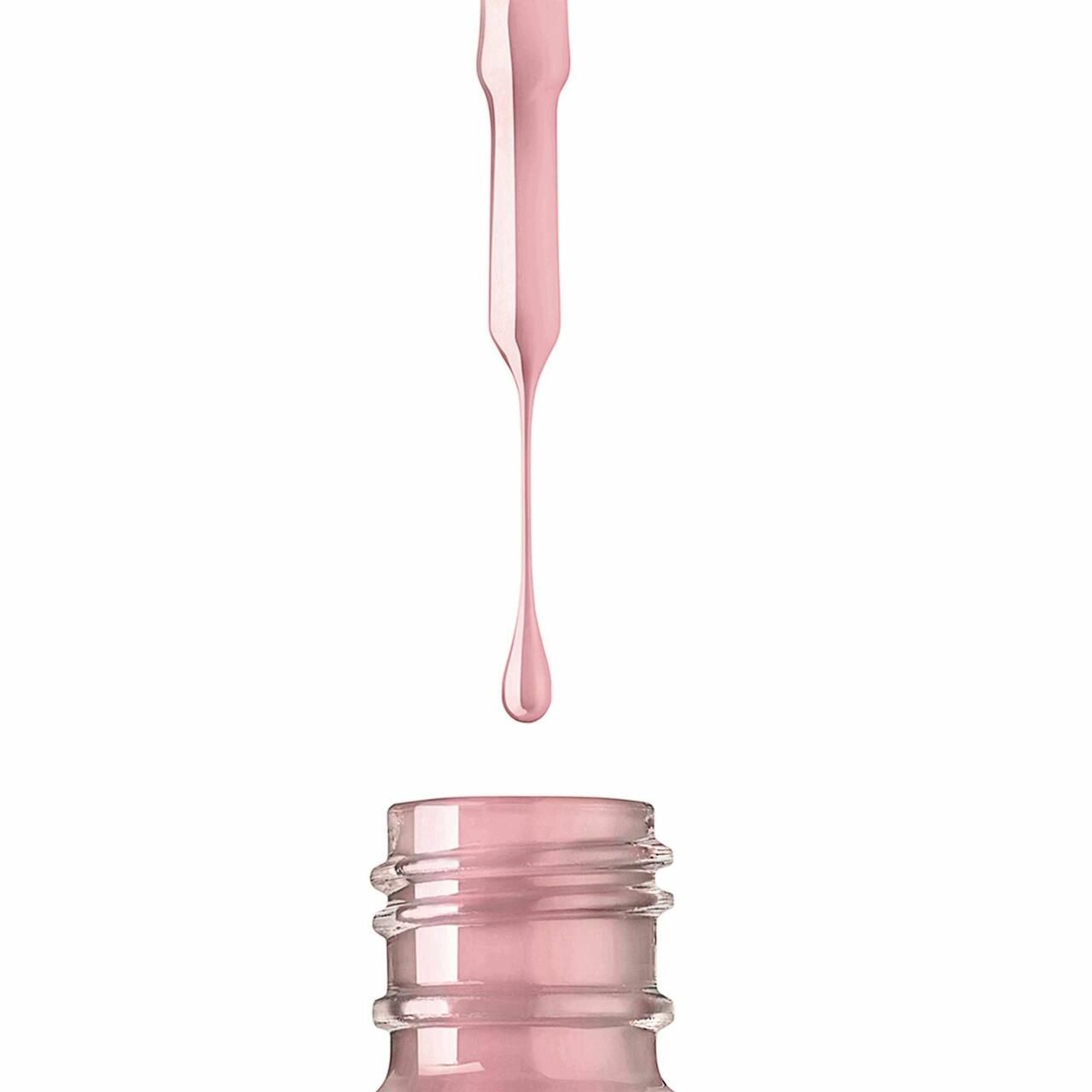 Goccia di smalto sopra l'apertura del flacone. Smalto rosa che cola dal pennello. Flacone con collo scanalato.