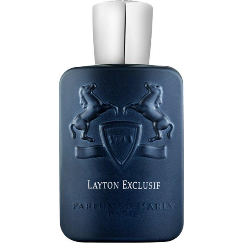 Flacone di profumo blu scuro con tappo argentato. Logo e testo in rilievo sul davanti.