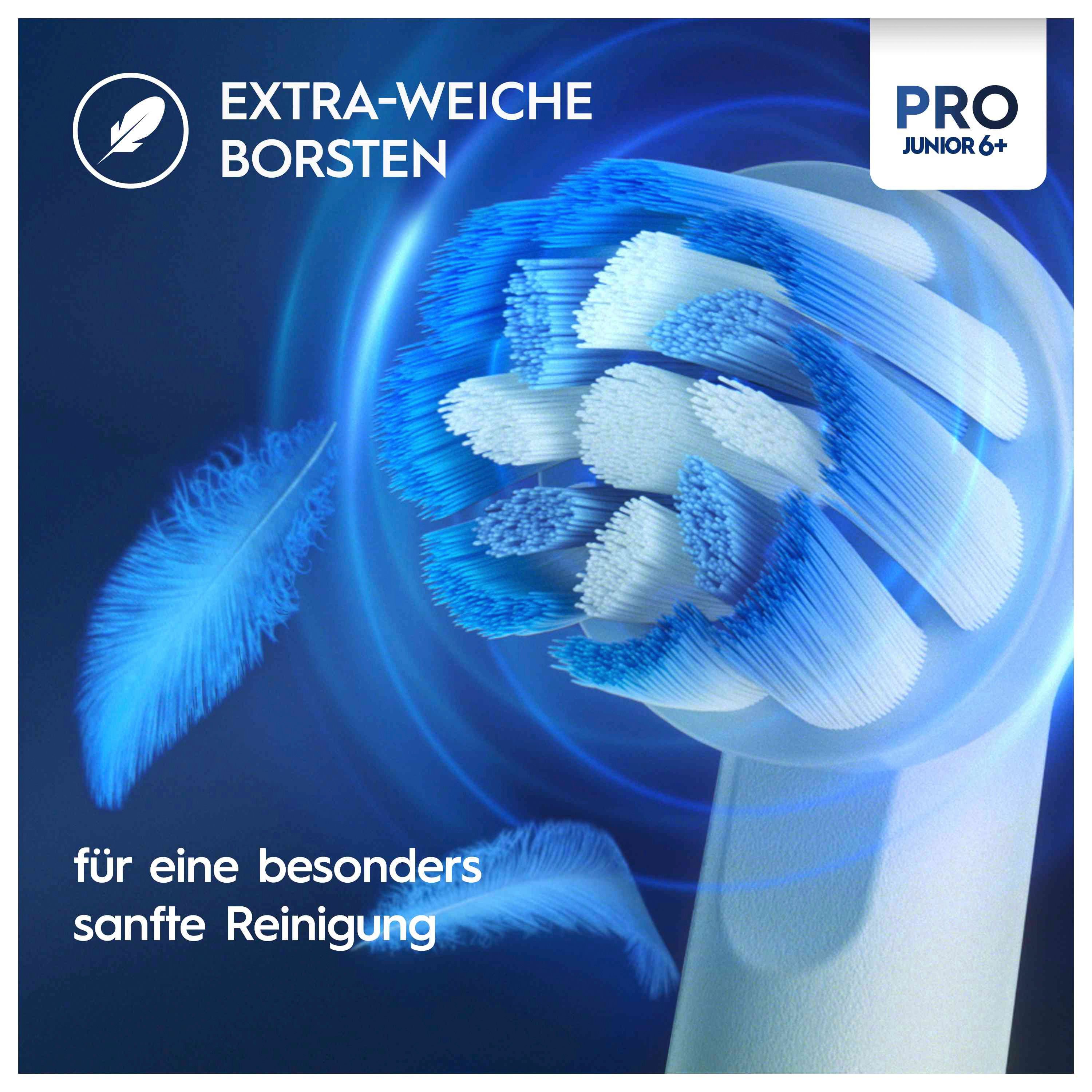 Primo piano della testina di uno spazzolino elettrico. Setole blu e bianche. Testo: Setole extra-morbide. Marchio Oral-B, modello Pro Junior 6+.