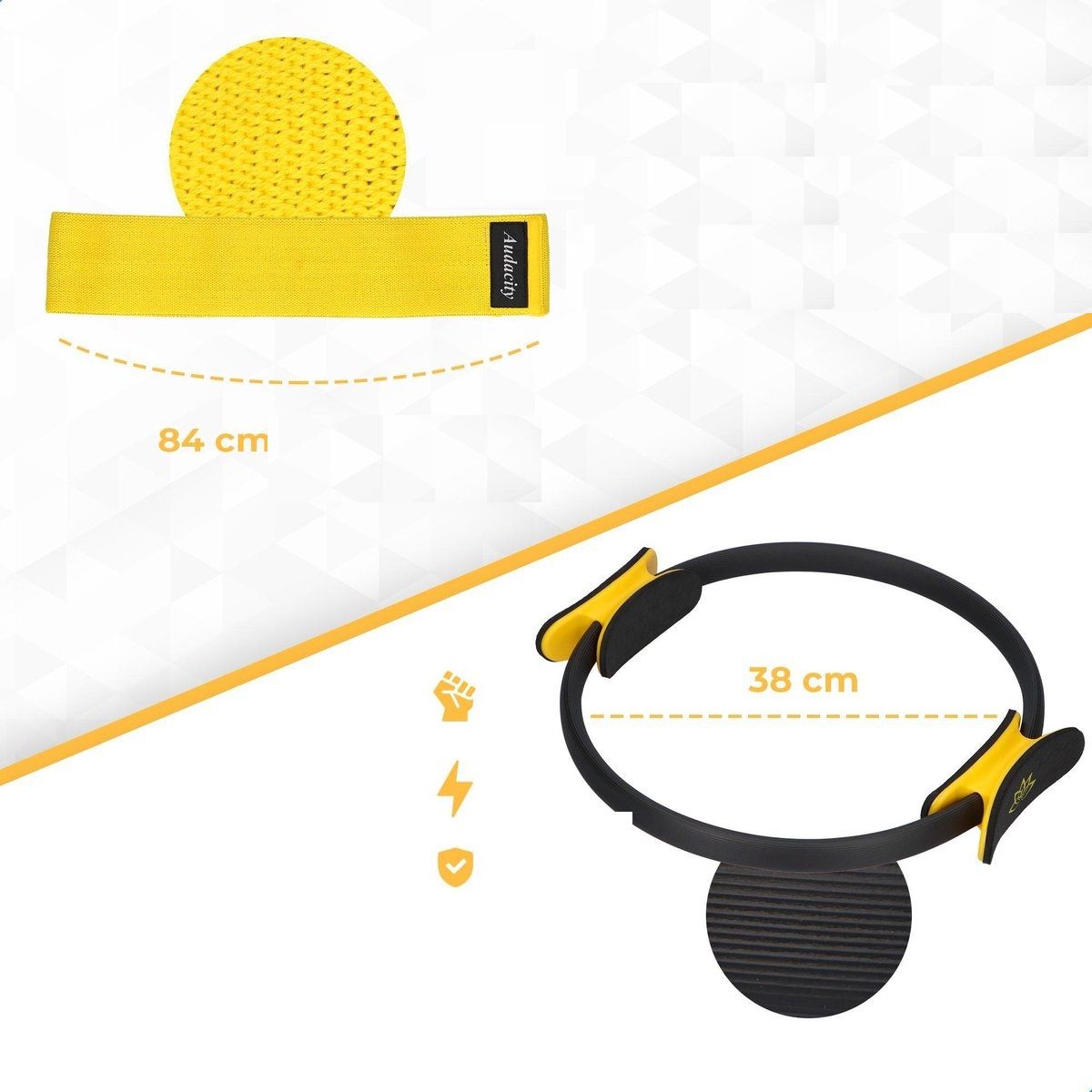 Fascia elastica gialla e anello Pilates. Fascia: 84 cm. Anello: 38 cm. Dettagli gialli. Anello nero con maniglie gialle.