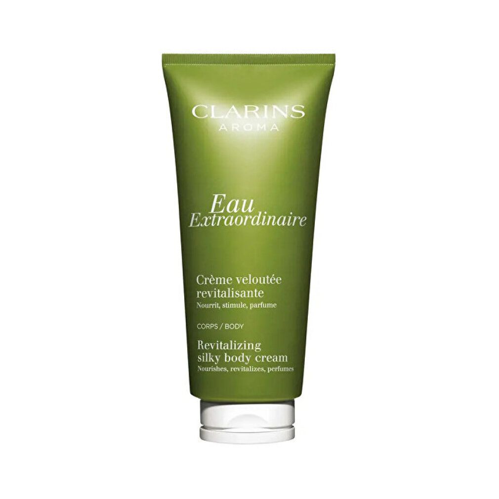 Tubo verde Clarins Eau Extraordinaire Body Cream. Testo: Aroma, Crème veloutée revitalisante, Revitalizing silky body cream.
