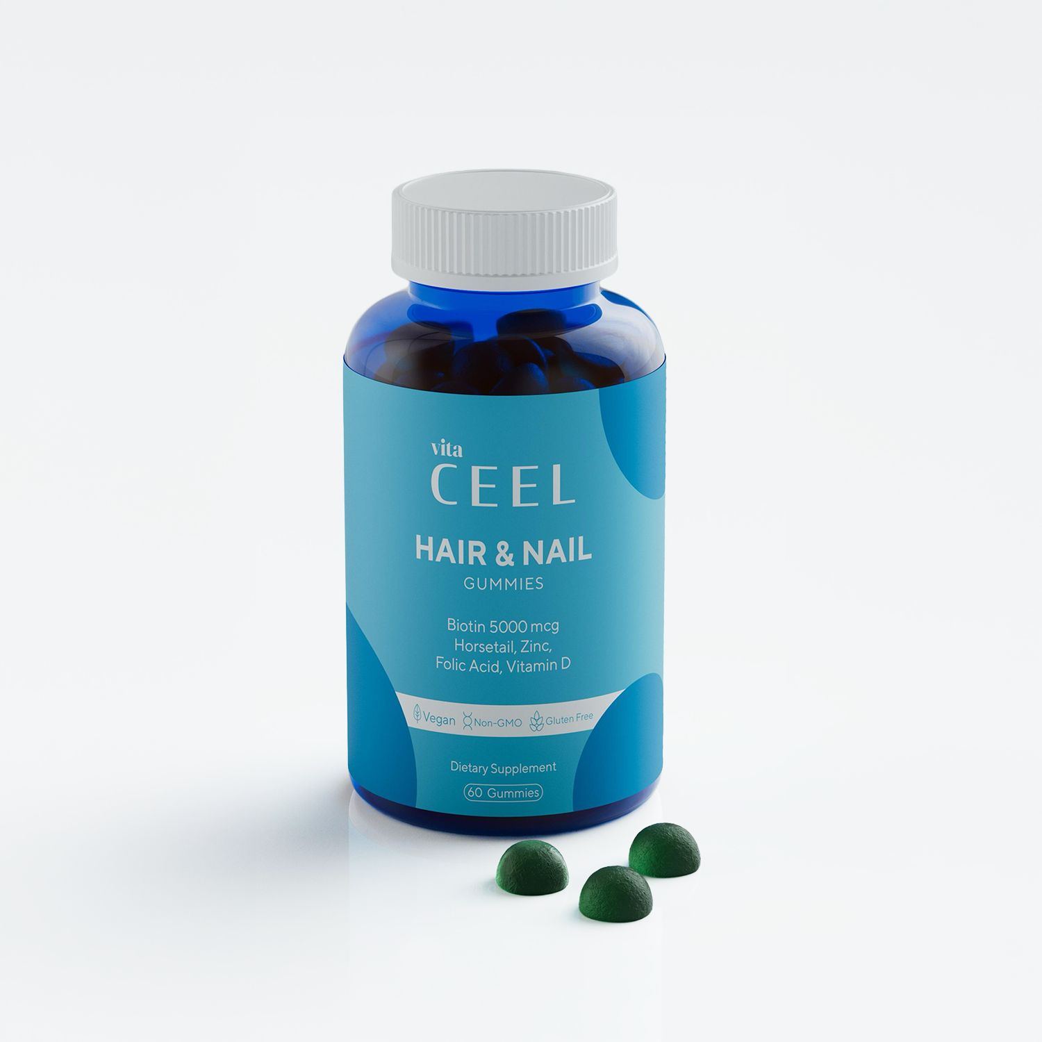 Flacone di Vita CEEL Hair & Nail Gummies. Contiene biotina, zinco, acido folico, vitamina D. Tre caramelle gommose verdi accanto.