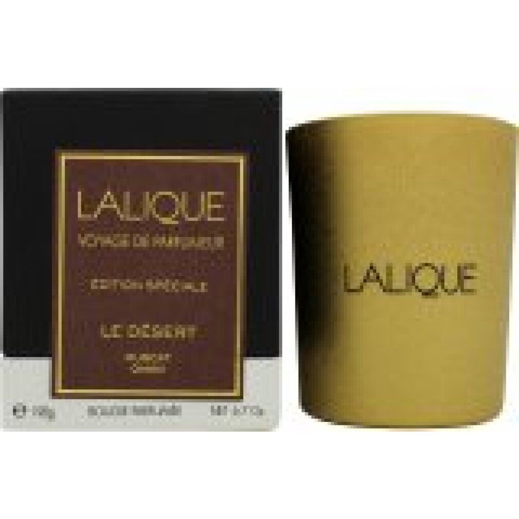 Candela dorata e scatola nera. Scritta "LALIQUE", "Le Désert Muscat Oman".