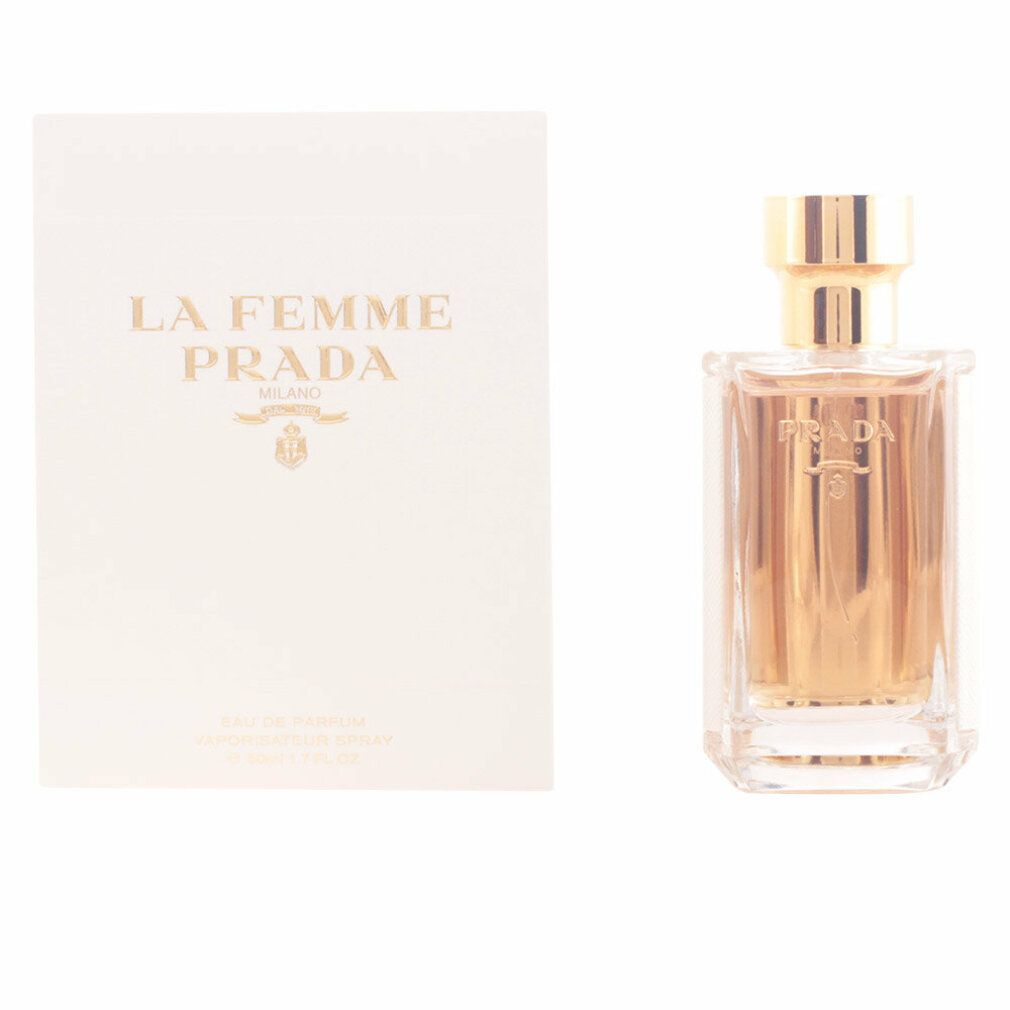 Flacone di profumo e confezione. Scritta: LA FEMME PRADA MILANO. Scritta dorata su sfondo bianco. Flacone con tappo dorato.