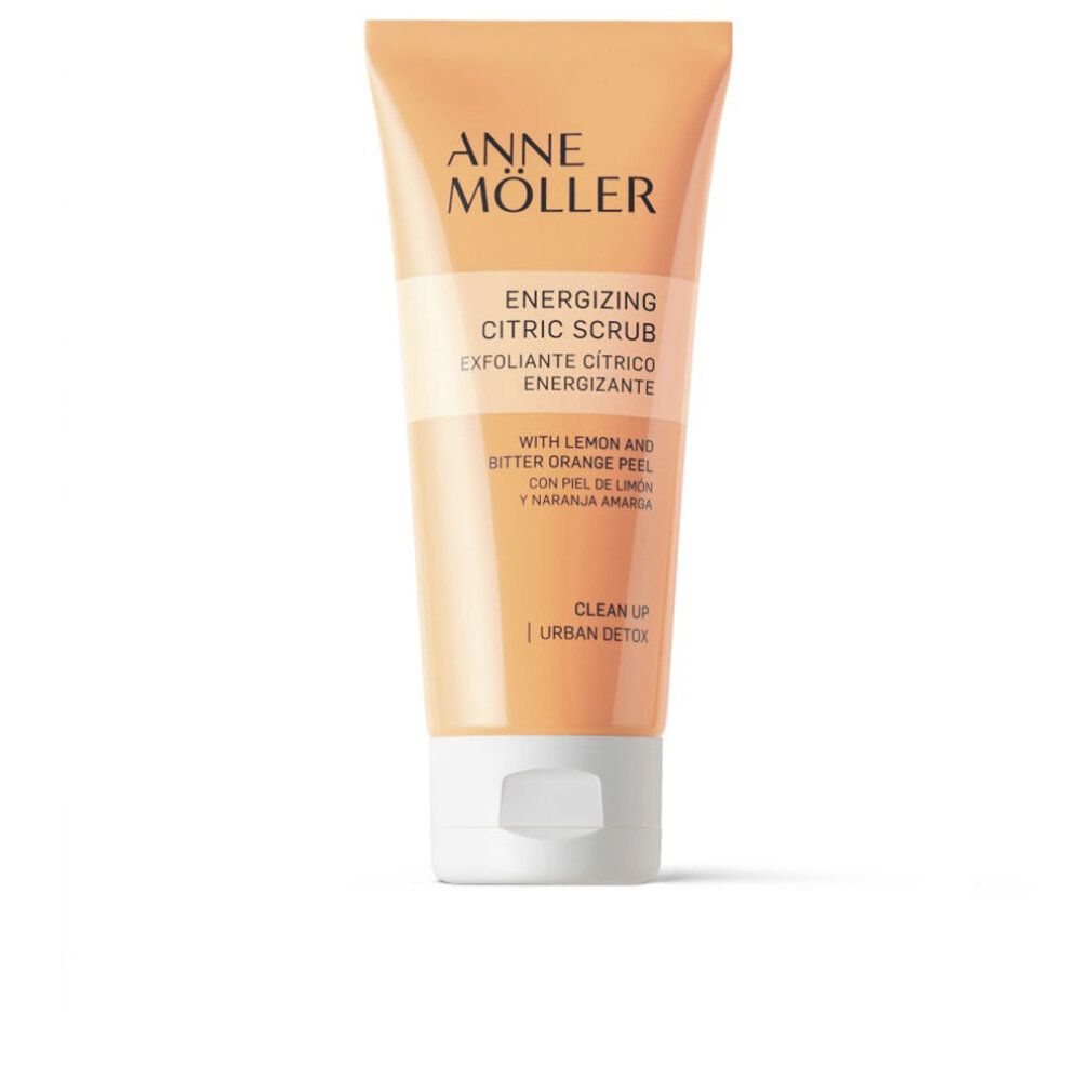 Tubo arancione con tappo bianco. Scritta: Anne Möller, Energizing Citric Scrub. Con scorza di limone e arancia amara.