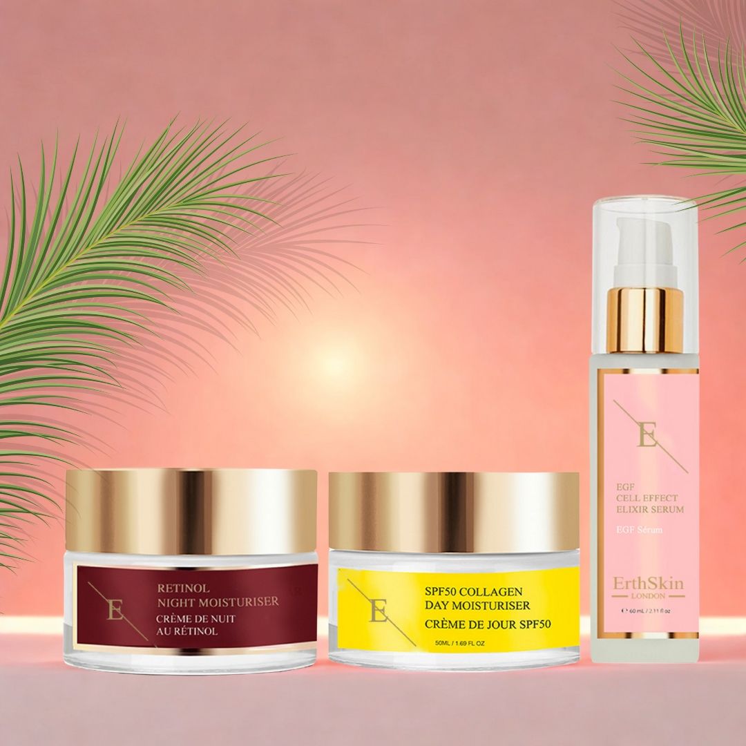 Tre prodotti cosmetici: crema giorno, crema notte e siero. Vasetti di crema con coperchi dorati, flacone di siero con dosatore. Etichettatura in inglese e francese.