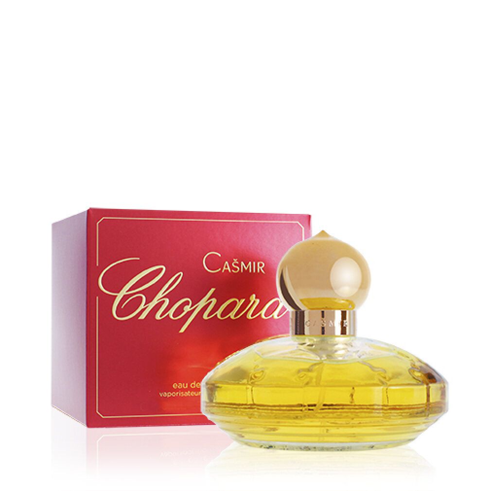 Flacone di profumo giallo con tappo dorato e confezione rossa. Scritta: Casmir Chopard.