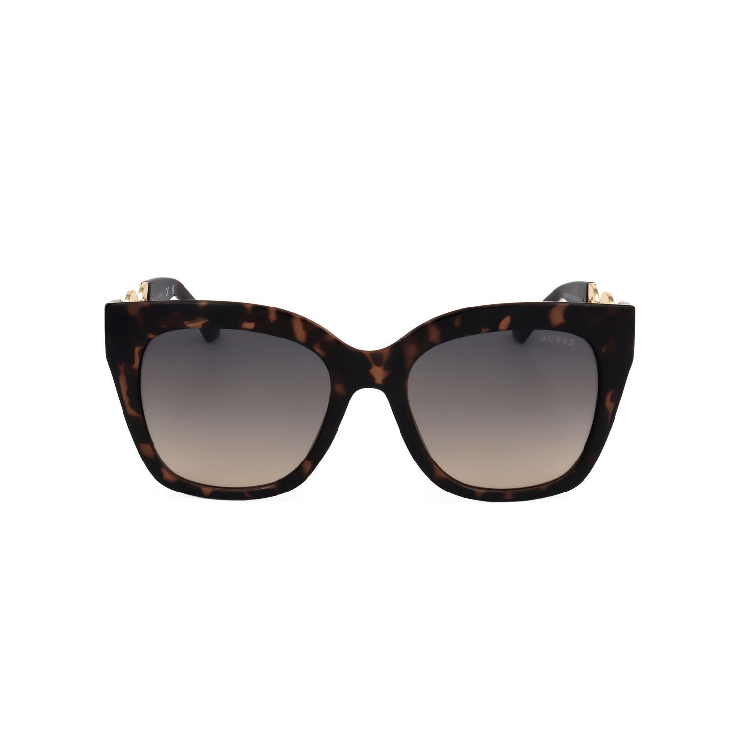 Occhiali da sole tartarugati stile cat-eye con lenti sfumate e dettagli dorati sulle aste.