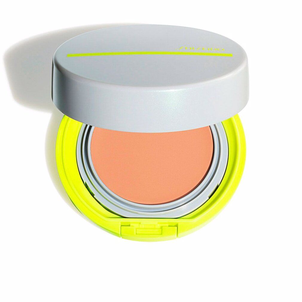 Cipria compatta aperta. Coperchio grigio con linea gialla. Cornice gialla, cipria rosa.