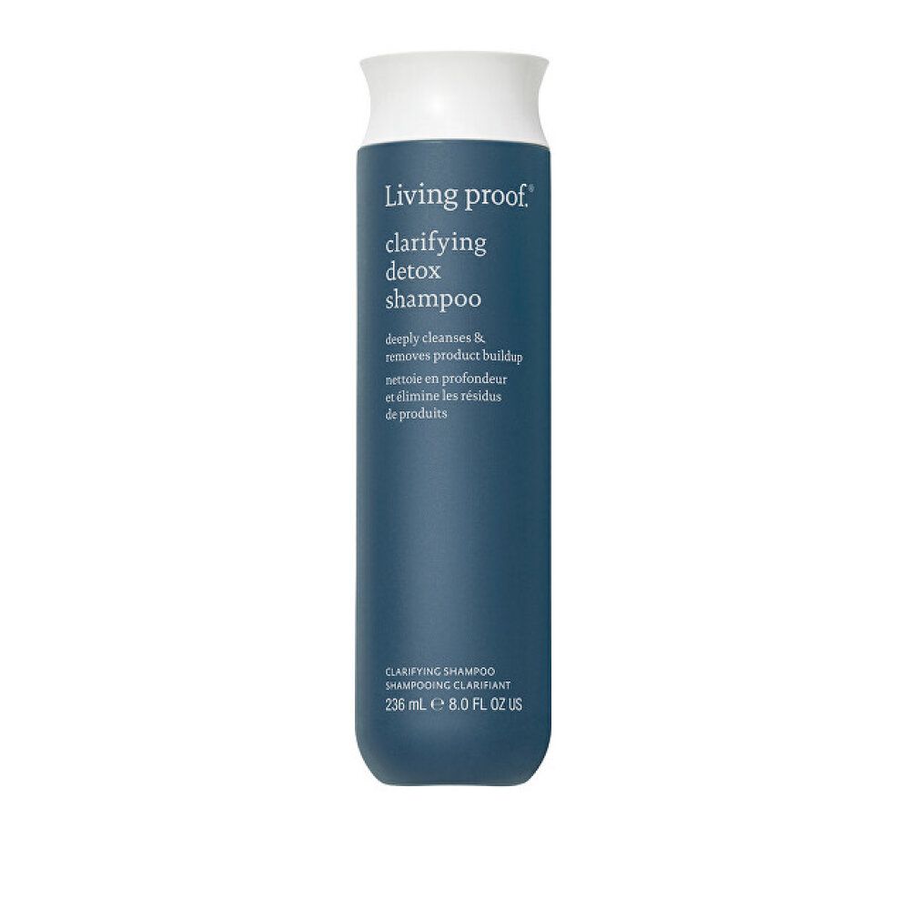 Flacone di shampoo blu scuro con tappo bianco. Scritta: Living proof, clarifying detox shampoo. Volume: 236 ml, 8.0 FL OZ US.