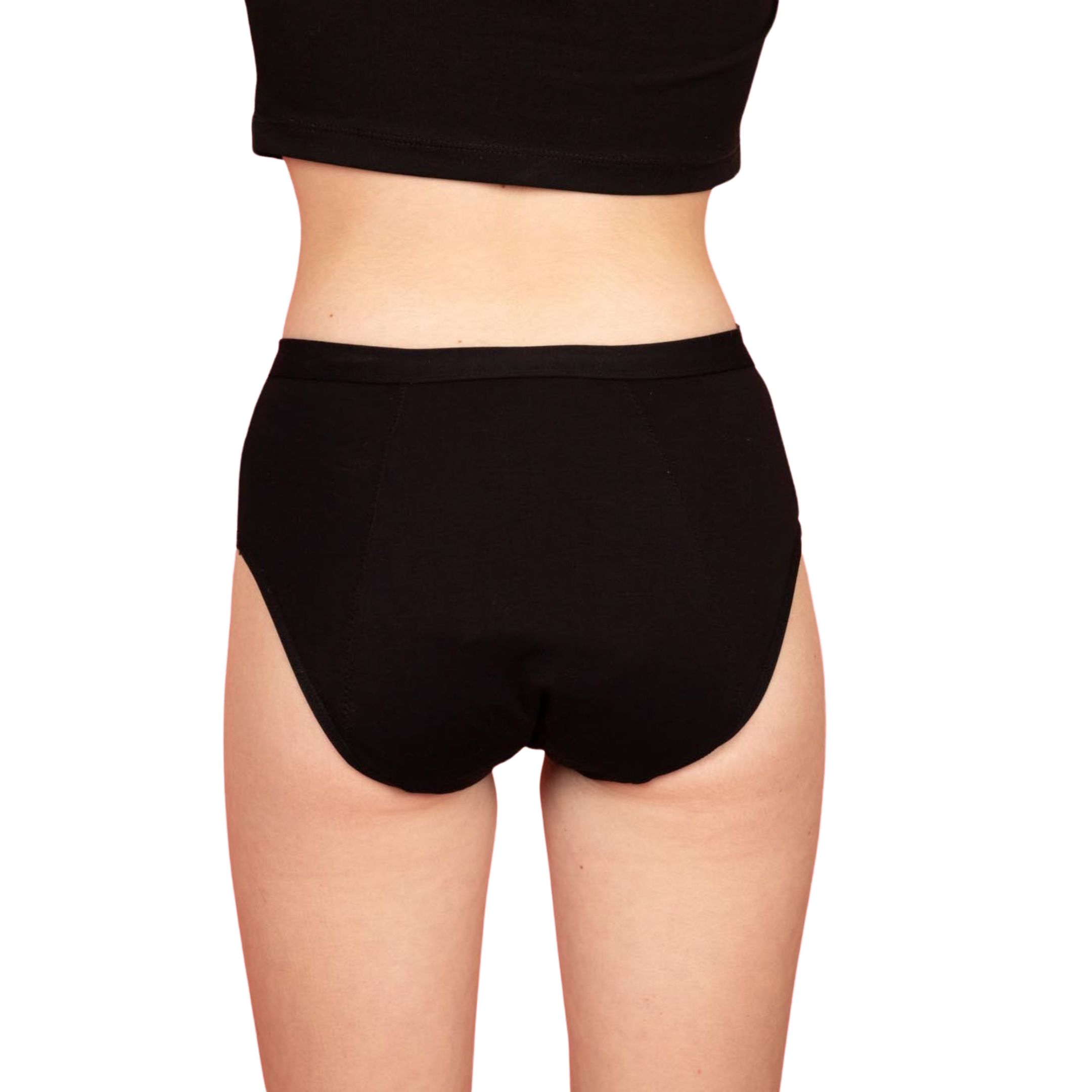 Slip mestruale nero per adolescenti. Vista posteriore della parte inferiore del corpo. La modella indossa top e slip neri.