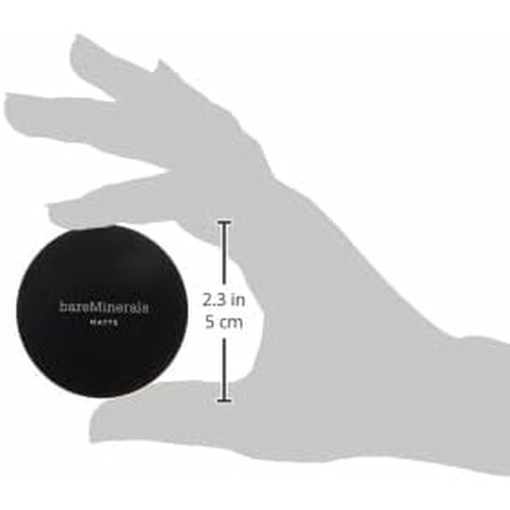 Coperchio nero "bareMinerals MATTE" tenuto in mano. Indicazione dimensioni: 2,3 pollici/5 cm.