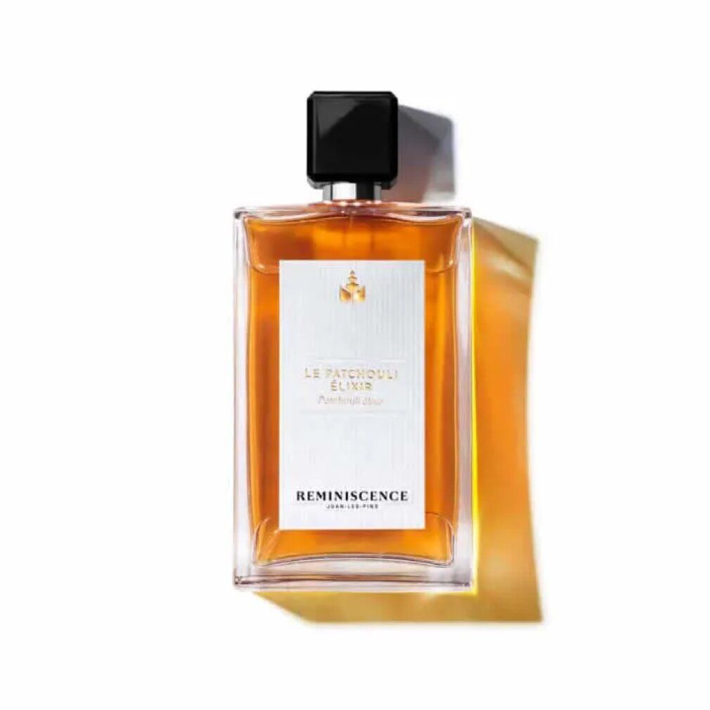 Flacone di profumo con tappo nero. Etichetta con testo: Le Patchouli Elixir, Reminiscence. Forma rettangolare, liquido trasparente.