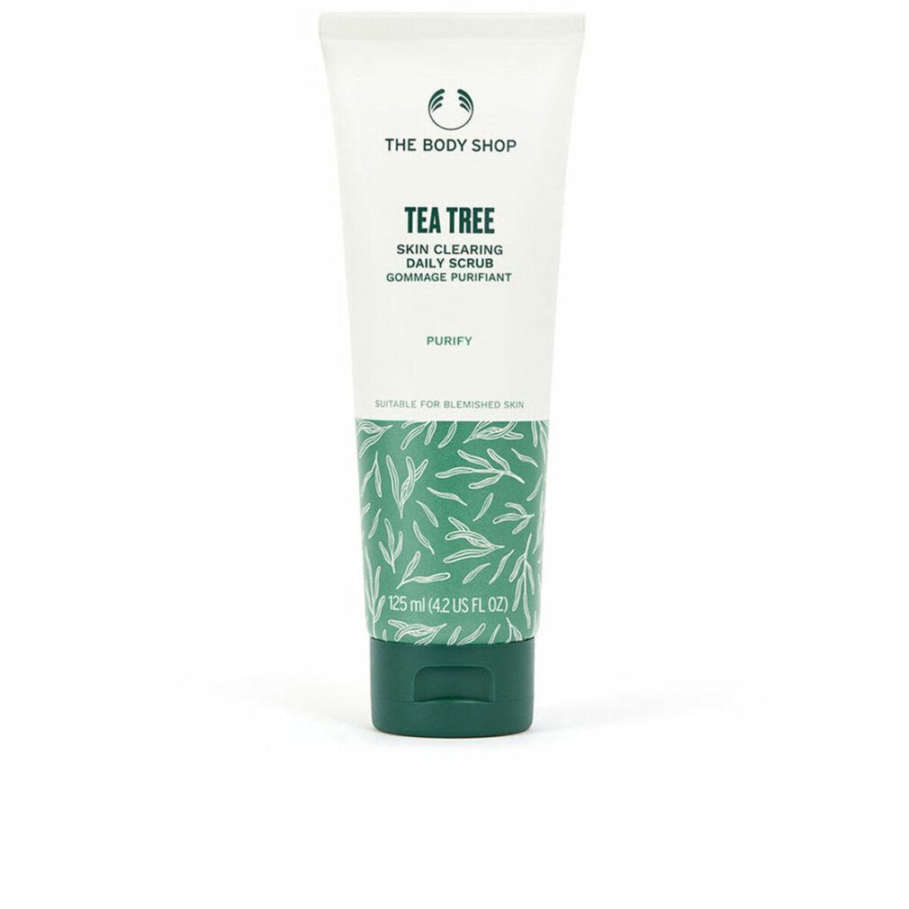 Tubo bianco e verde. Testo: Tea Tree, Skin Clearing Daily Scrub, Gommage Purifiant. Motivi a foglie verdi.