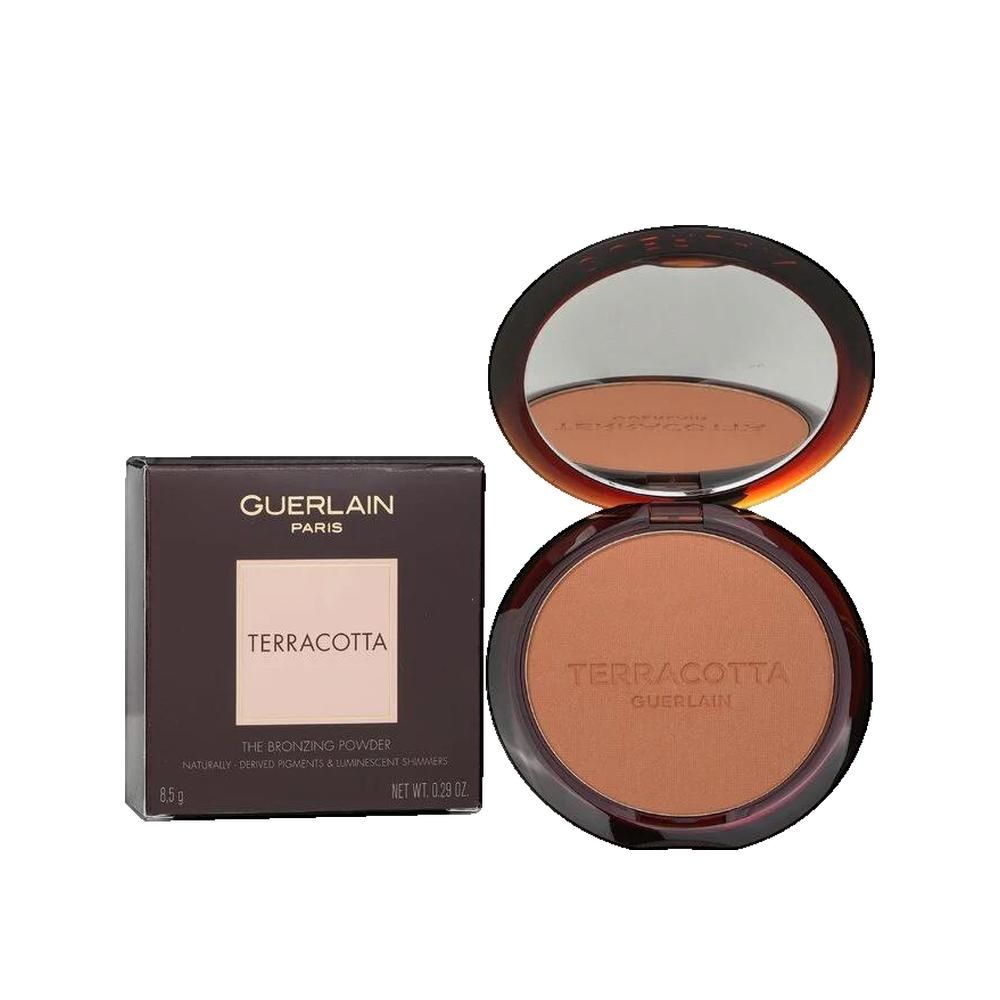 Cipria abbronzante compatta con specchio e confezione. Scritta "TERRACOTTA" e "GUERLAIN".