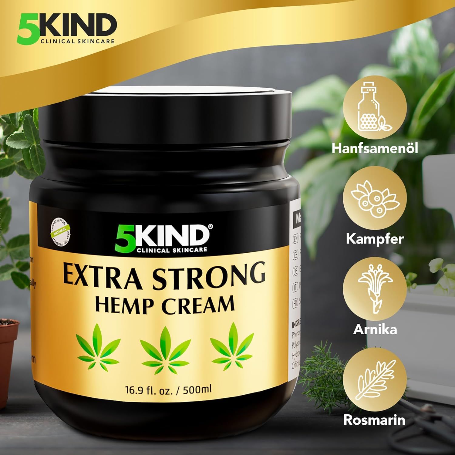 Vaso nero con etichetta dorata. Scritta: EXTRA STRONG HEMP CREAM. Tre foglie di cannabis. 16,9 fl. oz. / 500 ml. Illustrazione degli ingredienti.