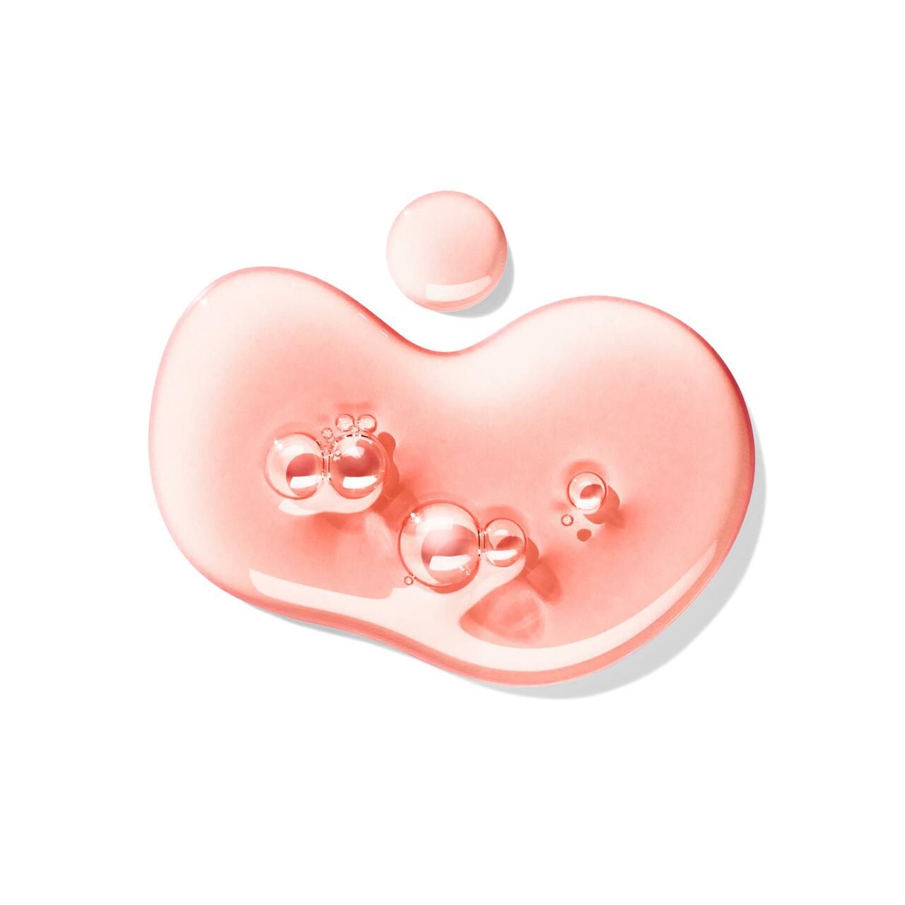 Gocce di liquido rosa con bolle. Su sfondo bianco.