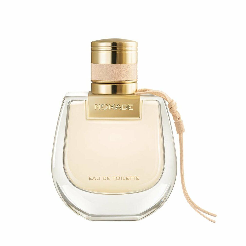 Flacone di profumo con tappo dorato e scritta "NOMADE". Cinturino in pelle beige. Scritta "EAU DE TOILETTE".