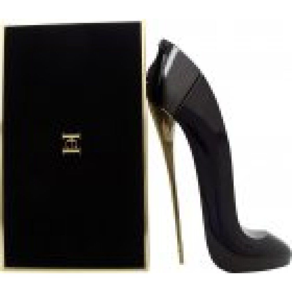 Flacone nero a forma di scarpa e confezione. Sulla confezione è scritto "Good Girl" e "Carolina Herrera".