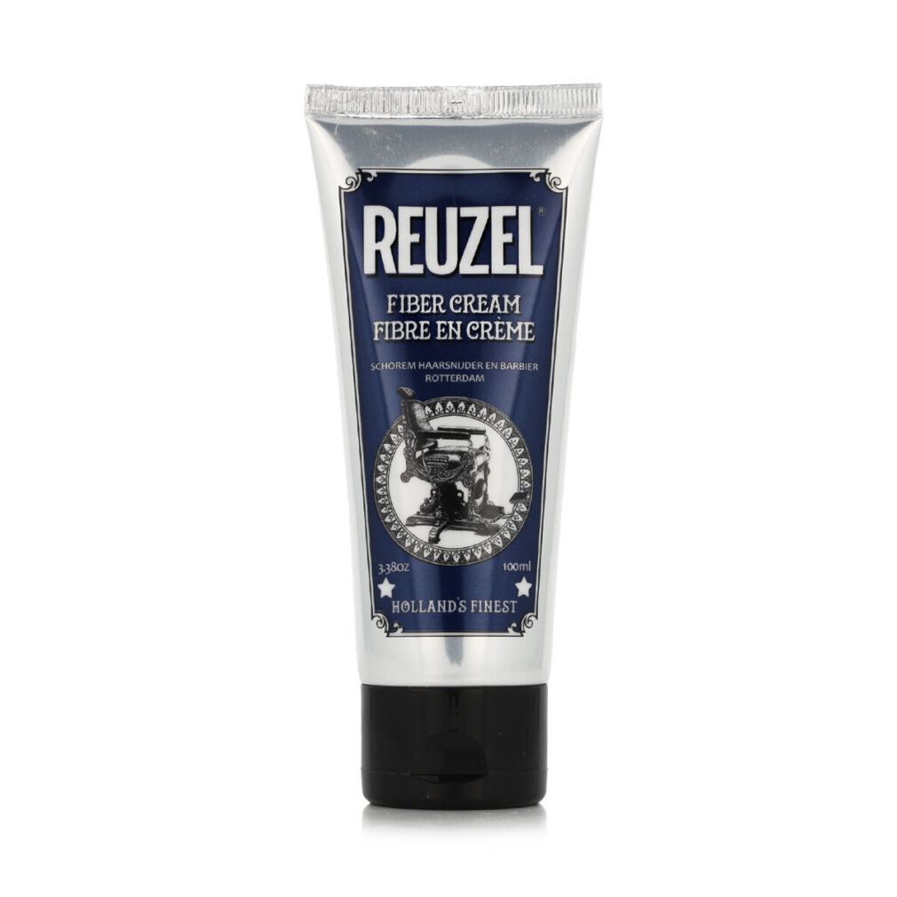 Tubo d'argento con etichetta blu. Scritta REUZEL FIBER CREAM. Immagine di una poltrona da barbiere. Tappo nero.